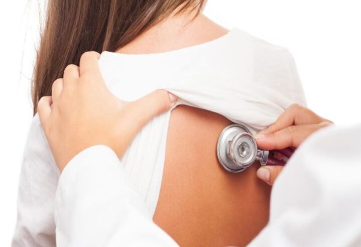 Doctor examines shoulder pain